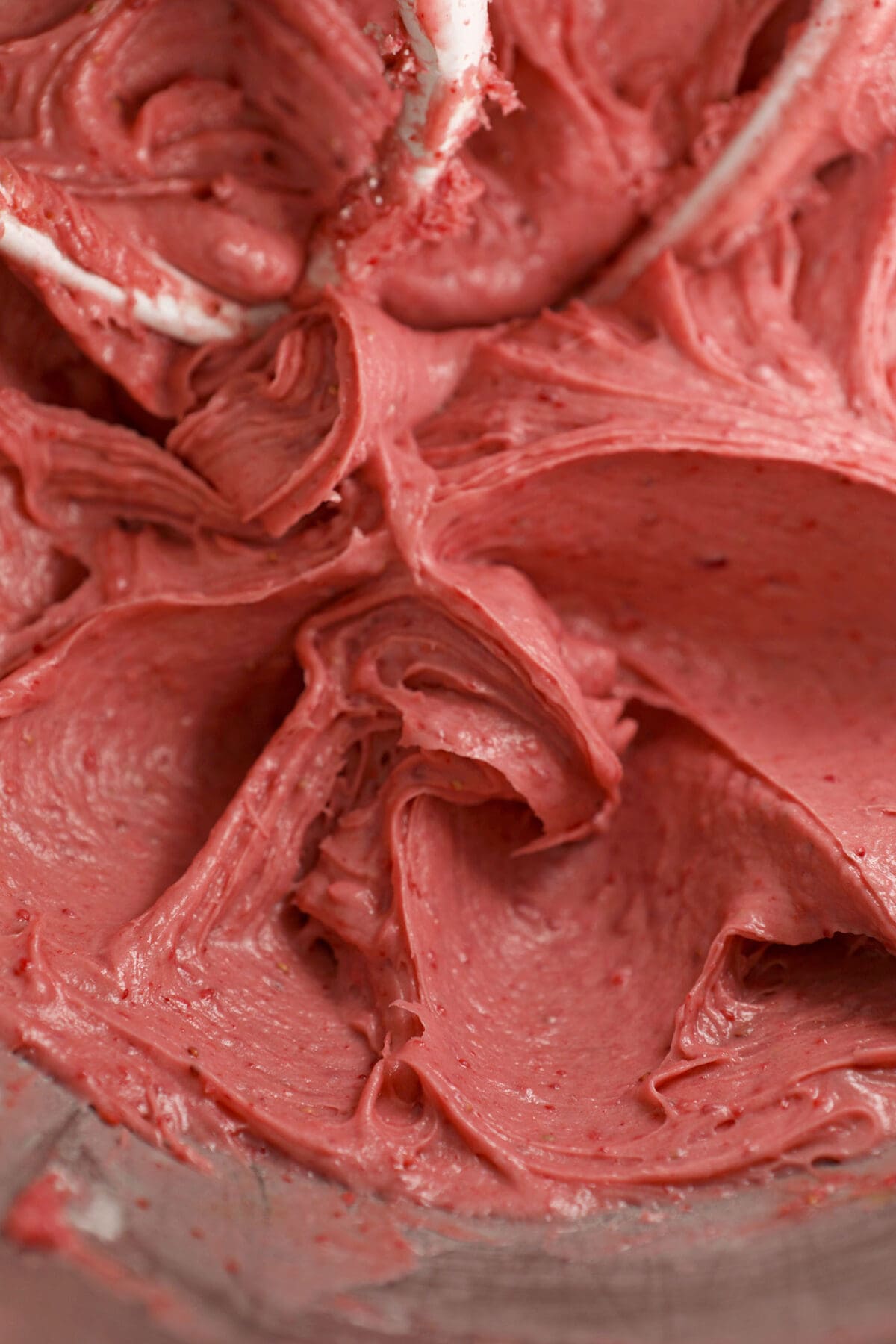 Close up of whipped Strawberry Cream Cheese Frosting in a bowl