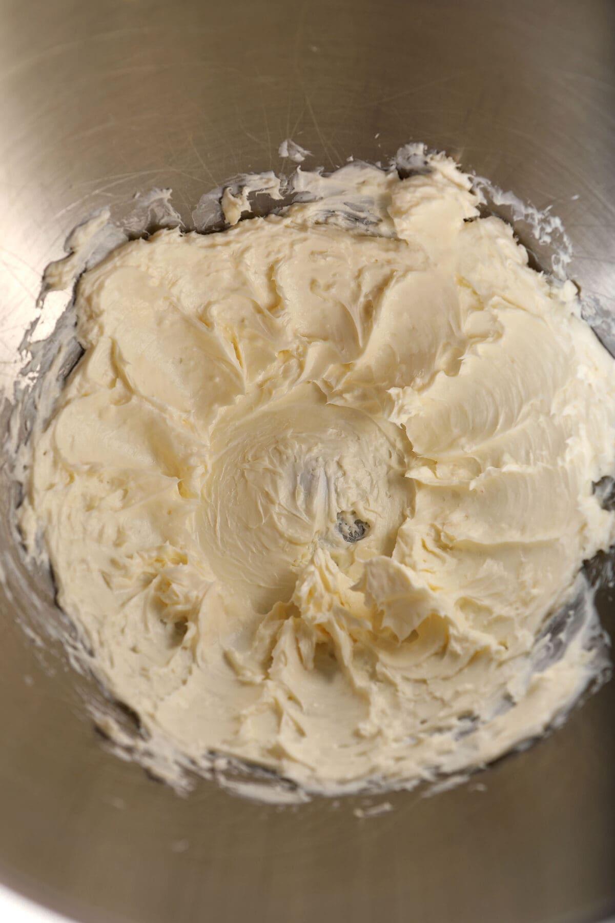 Whipped cream cheese and butter in a metal bowl
