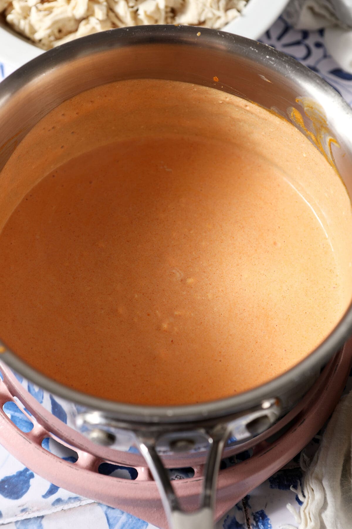 Melted sour cream, cream cheese and hot sauce in a sauce pan