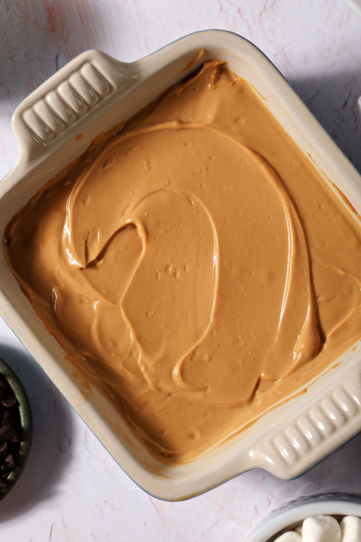Close up of caramel dip that will be used on a caramel apple board