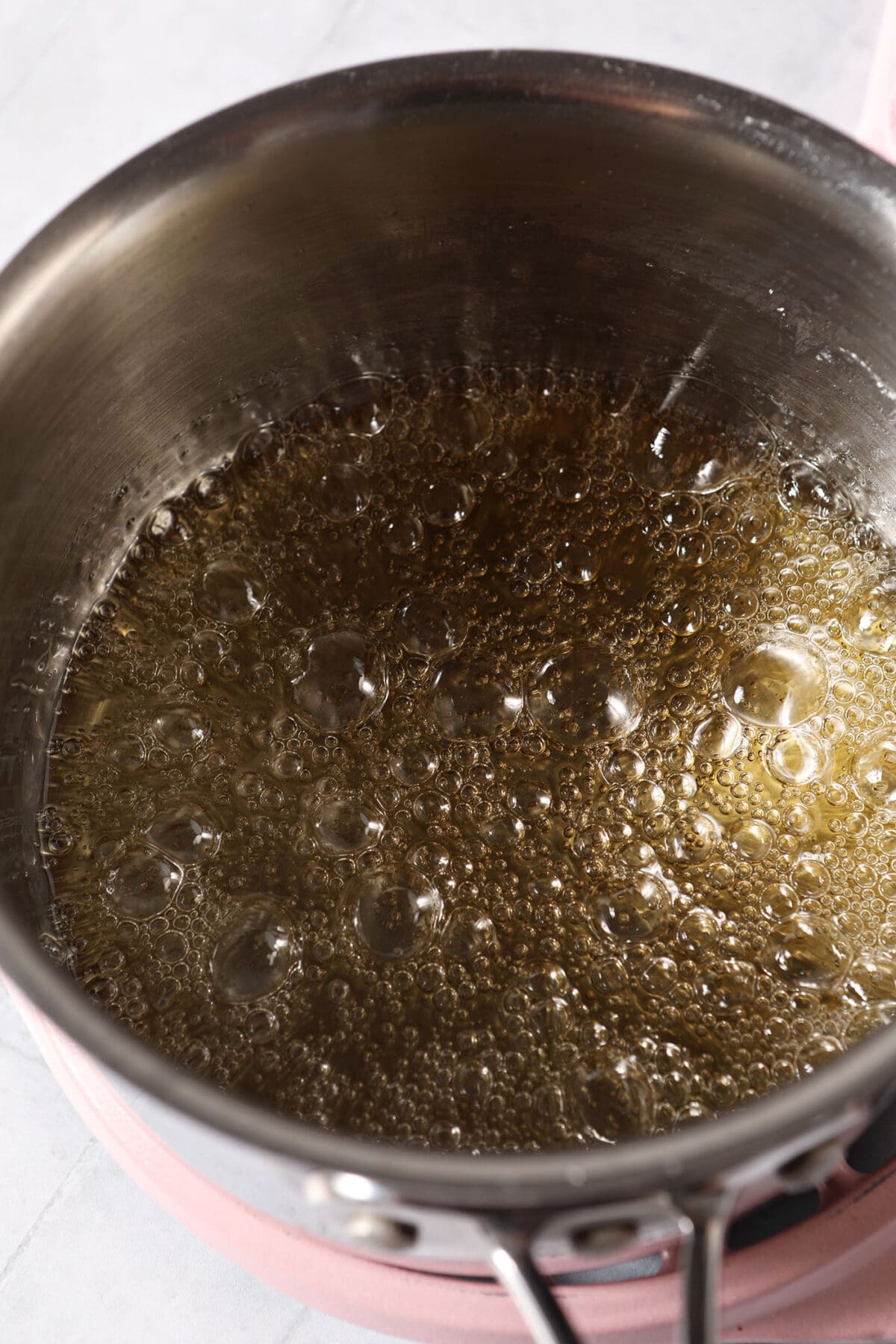 Sugar begins caramelizing in a saucepan