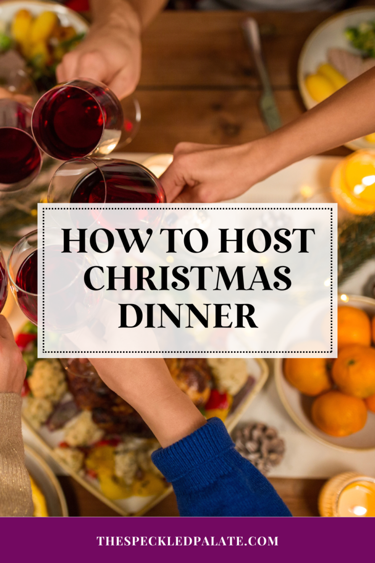 people cheers wine glasses over a decorated tabletop for christmas with the text how to host christmas dinner