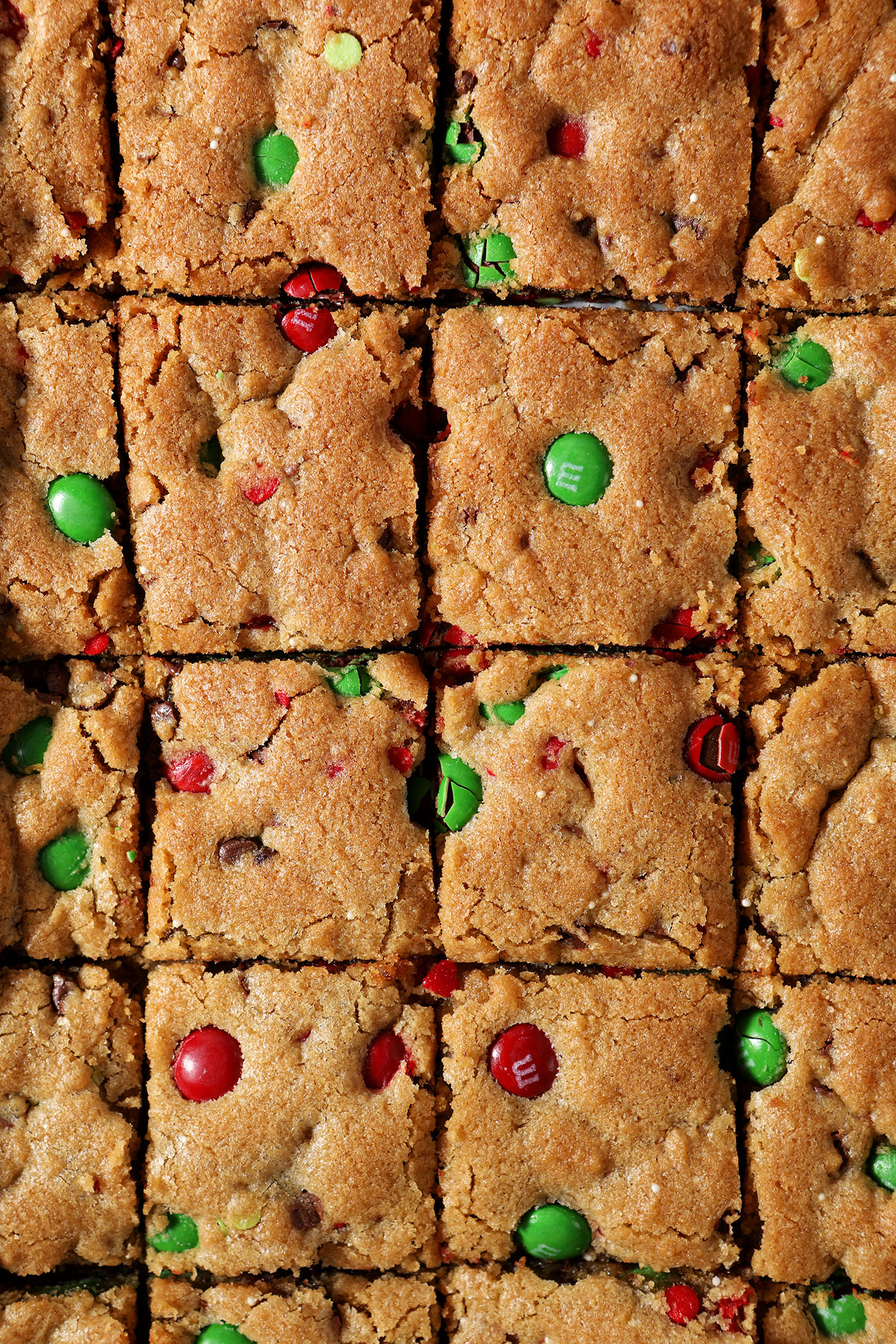 Overhead of sliced M&M cookie bars with Christmas M&Ms