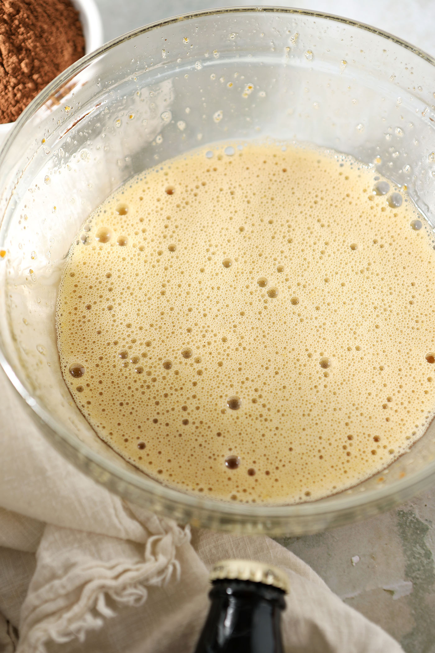 Whisked eggs and brown sugar in a bowl