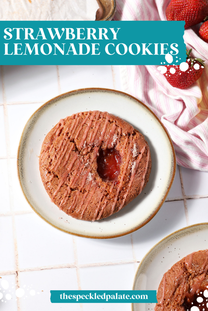 Two Strawberry Lemon Cookies on plates on a tiled white surface with a pink and white striped linen and fresh strawberries with the text strawberry lemonade cookies
