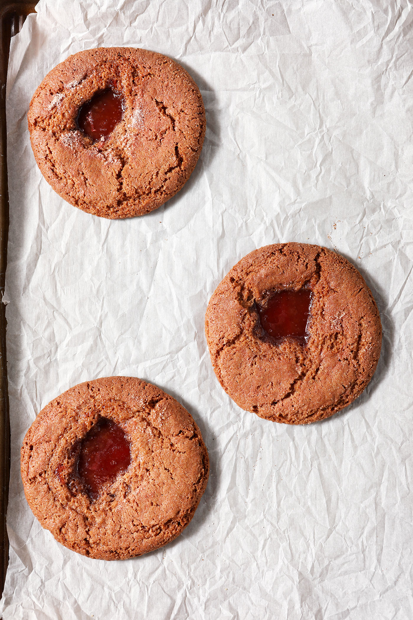 Baked Strawberry Lemonade Cookies on a parchment-lined sheet pan