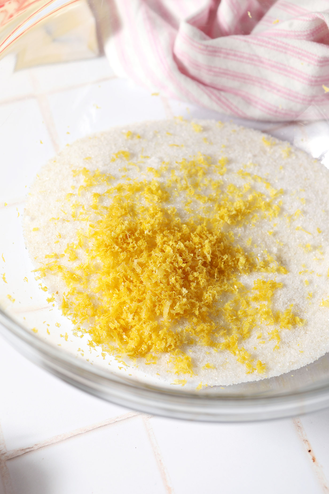 Lemon zest on top of sugar in a bowl