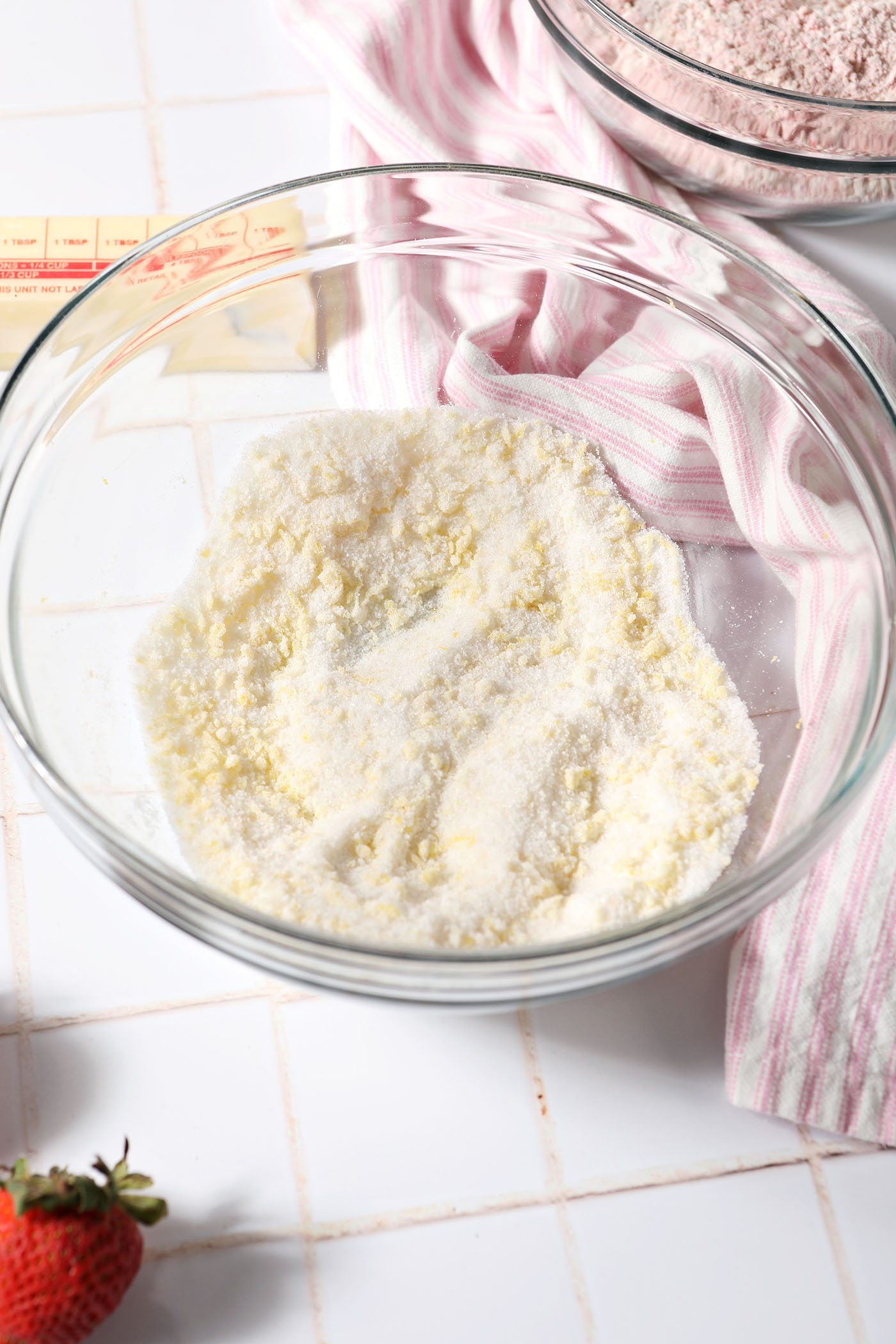 Lemon zest mixed in sugar in a bowl