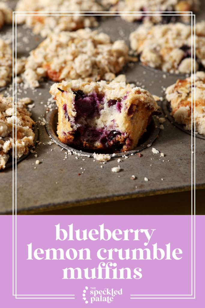 A bitten-into Lemon Blueberry Muffin in a muffin tin with more muffins with the text blueberry lemon crumble muffins