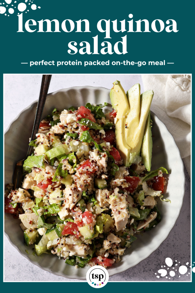 Overhead of a bowl holding a quinoa salad with chicken and veggies next to an avocado half and a lemon with the text lemon quinoa salad perfect protein packed on-the-go meal
