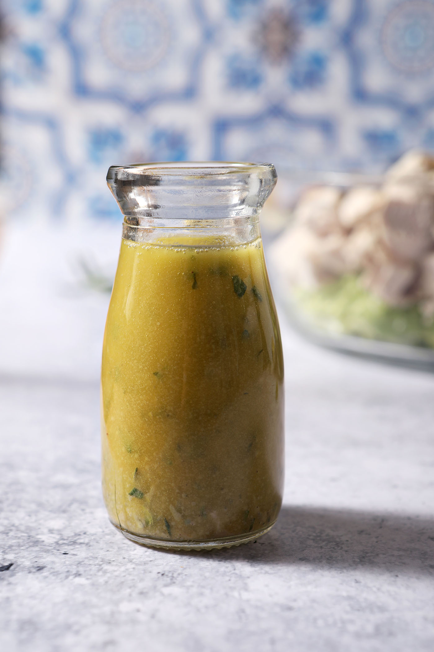 Close up of a bottle of homemade lemon vinaigrette