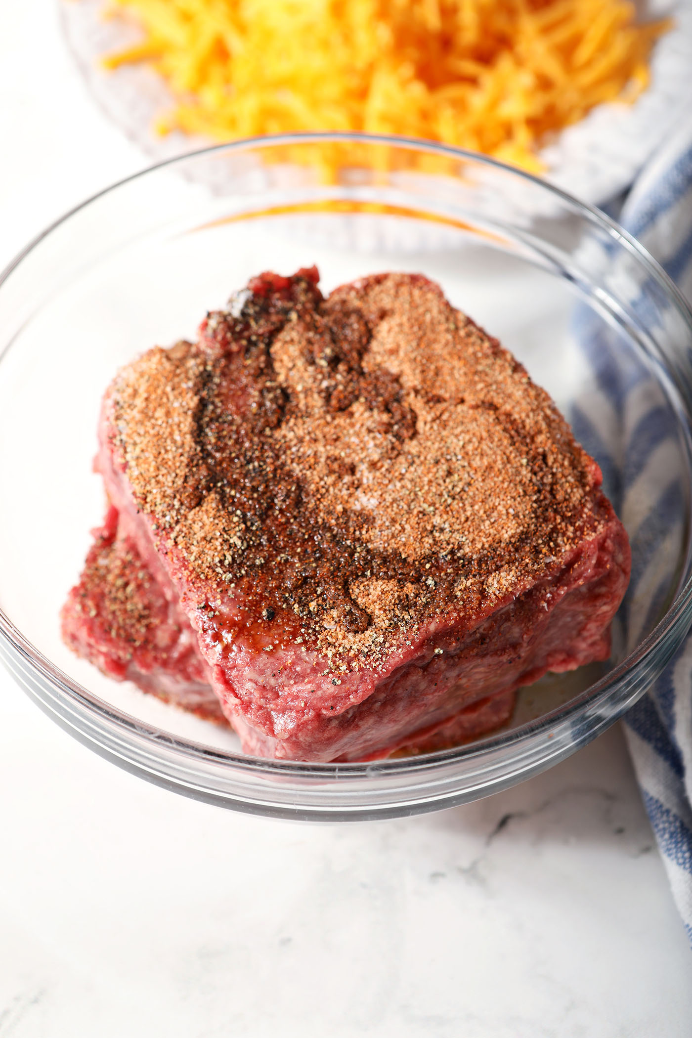 Seasoned ground beef before combining the ingredients in a bowl