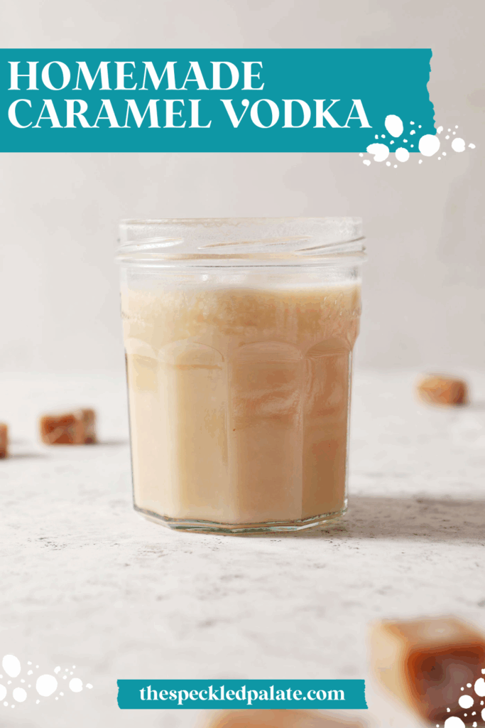 infused caramel vodka in a jar on a white stone surface surrounded by candy caramels with the text homemade caramel vodka
