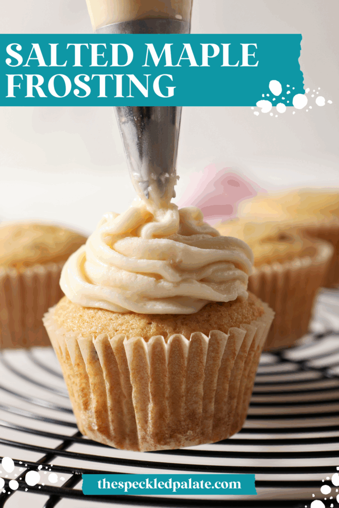 A cupcake is frosted with Maple Frosting in a frosting bag on a cooling rack with the text salted maple frosting