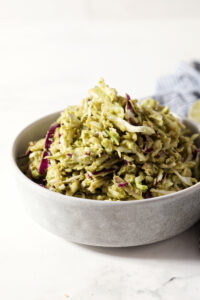 Side angle of homemade avocado coleslaw in a bowl