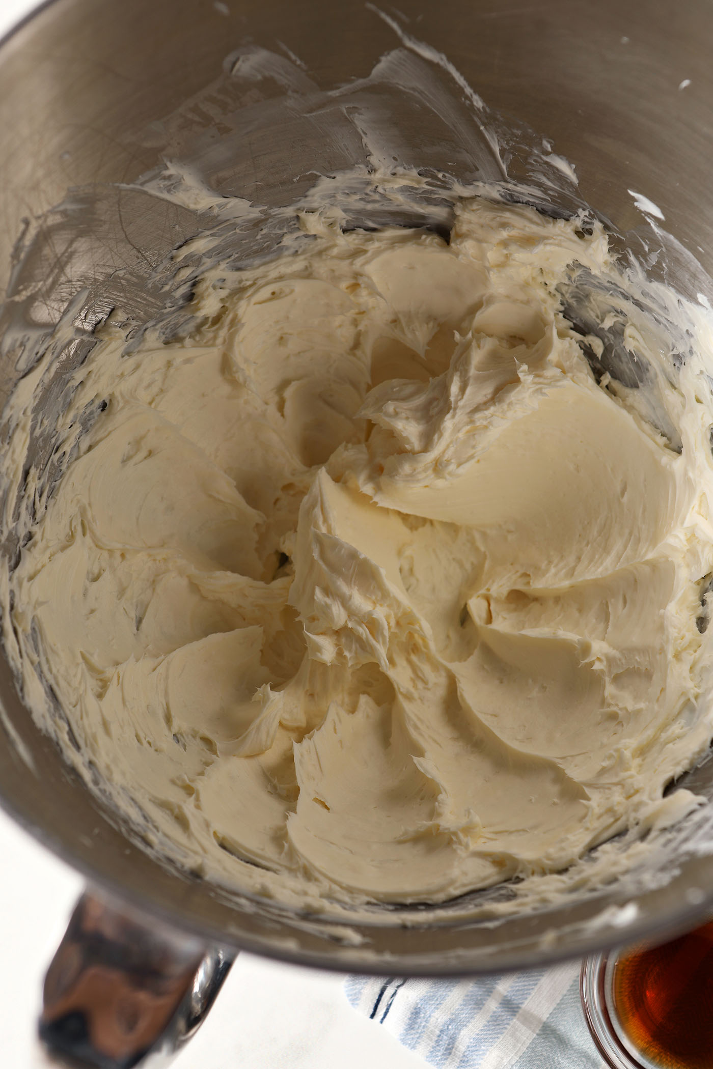Creamed butter and cream cheese in a metal bowl
