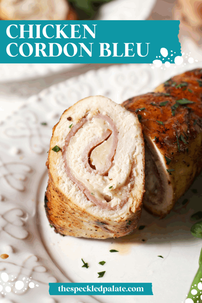 A sliced piece of chicken cordon bleu on a white plate with the text chicken cordon bleu