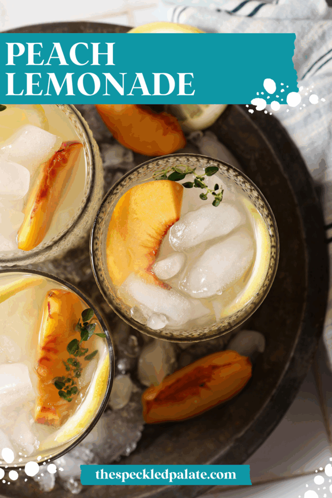 Overhead of three glasses of peach lemonade in a metal bowl with ice on a white tiled surface with a blue striped linen with the text peach lemonade