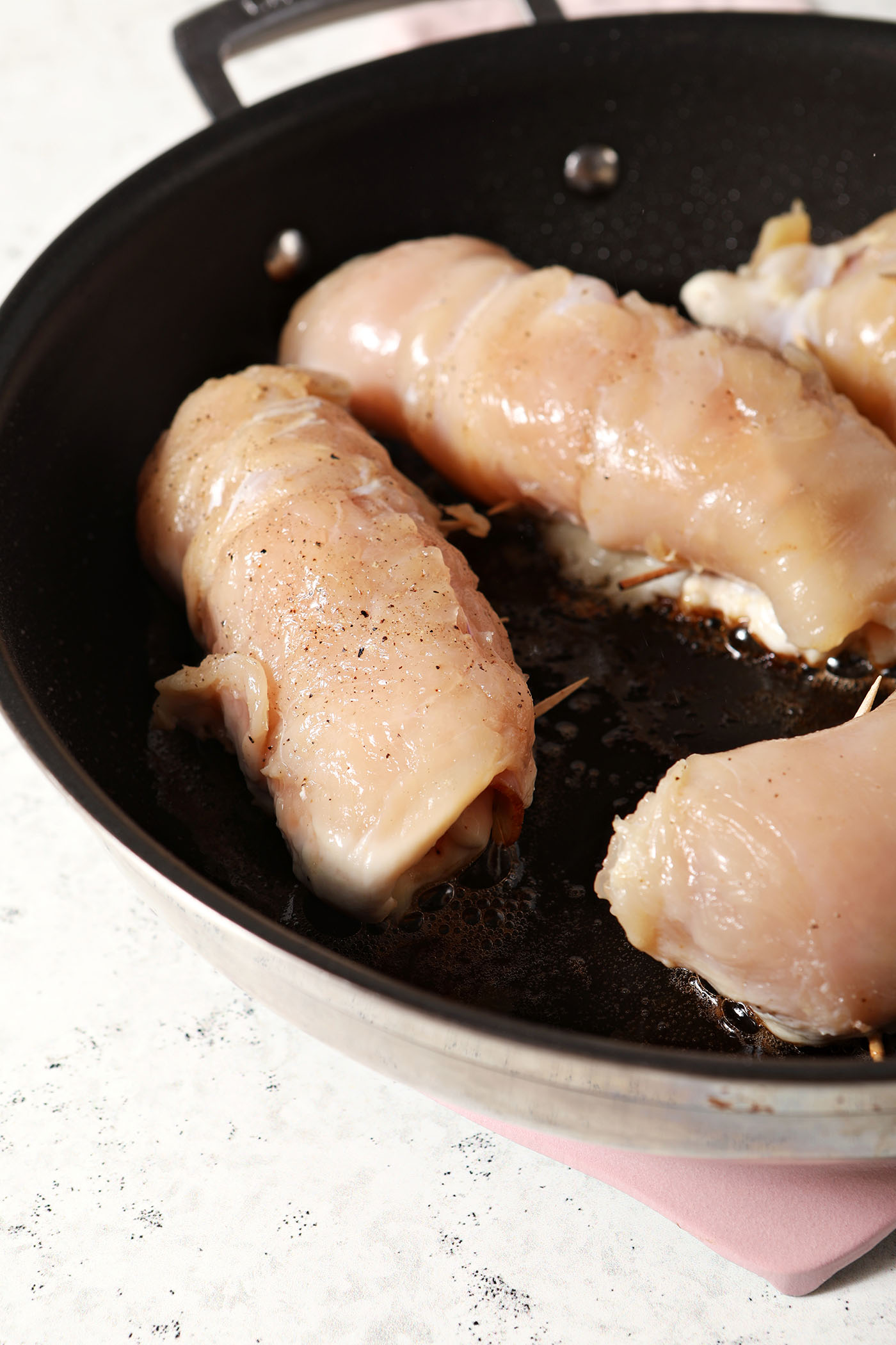 Chicken cordon bleu sears in a skillet