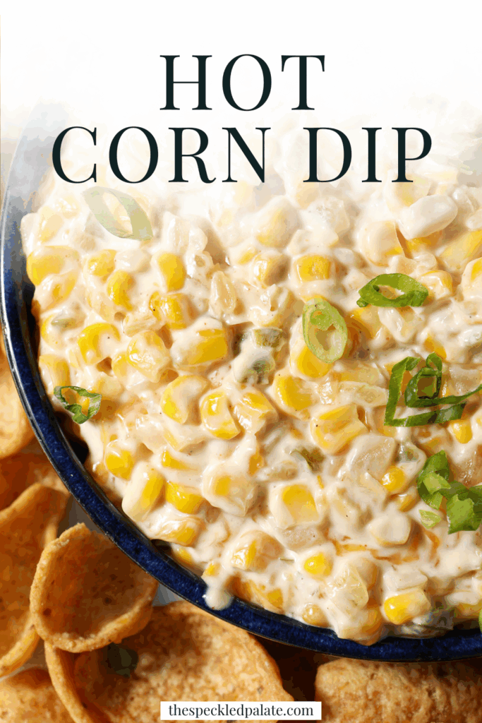 Close up of creamy corn dip from above, garnished with green onions and surrounded by corn chips with the text hot corn dip