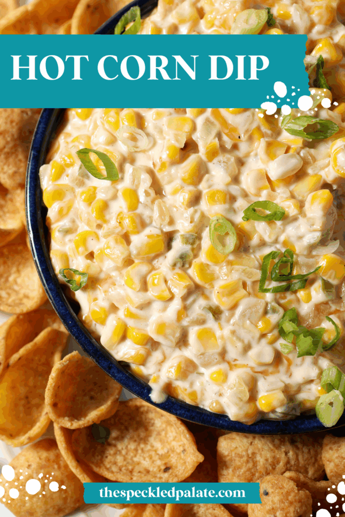 Close up of corn dip from above, garnished with green onions and surrounded by corn chips with the text hot corn dip