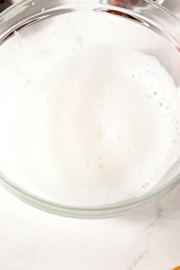 Egg whites whipped in a bowl