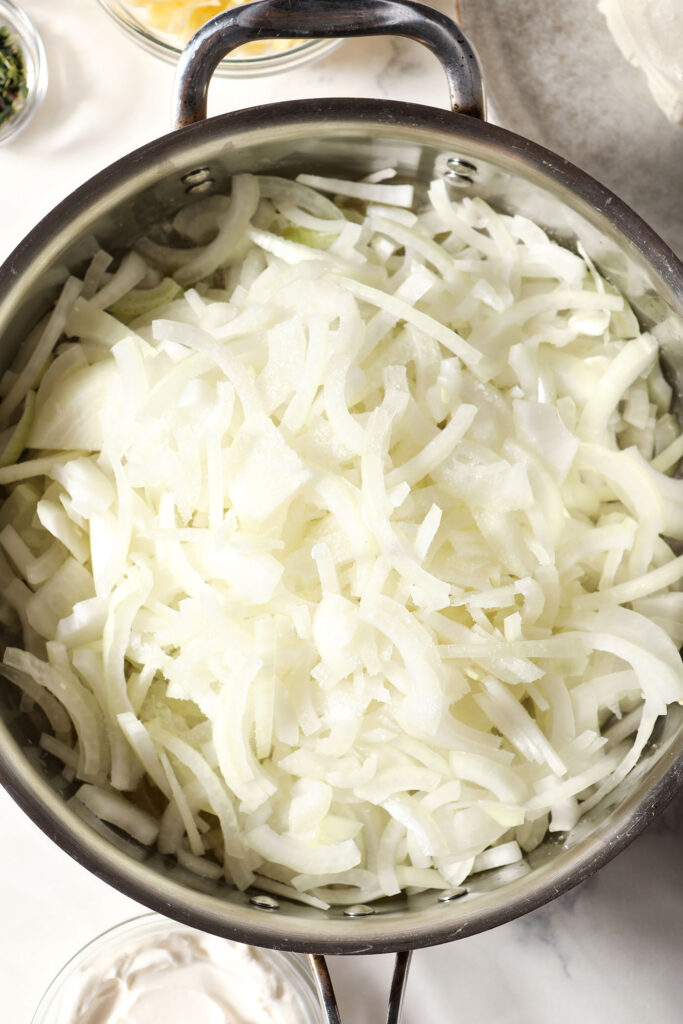 Onions in a skillet with salt before cooking