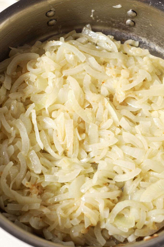 Onions begin browning in a pan