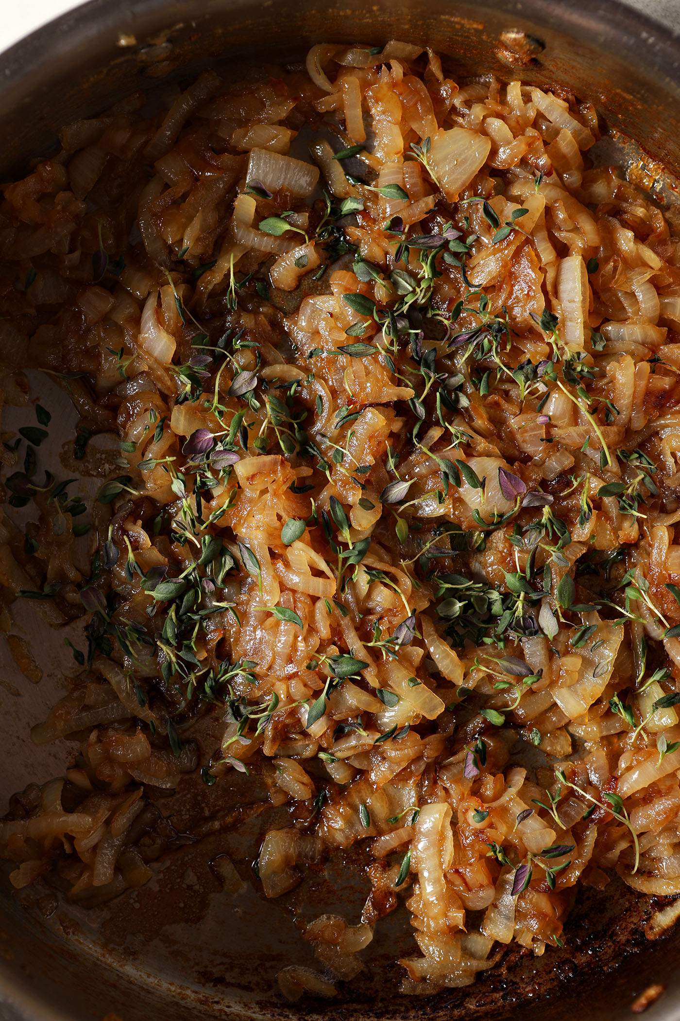 Caramelized onions are seasoned with Worcestershire sauce and fresh thyme