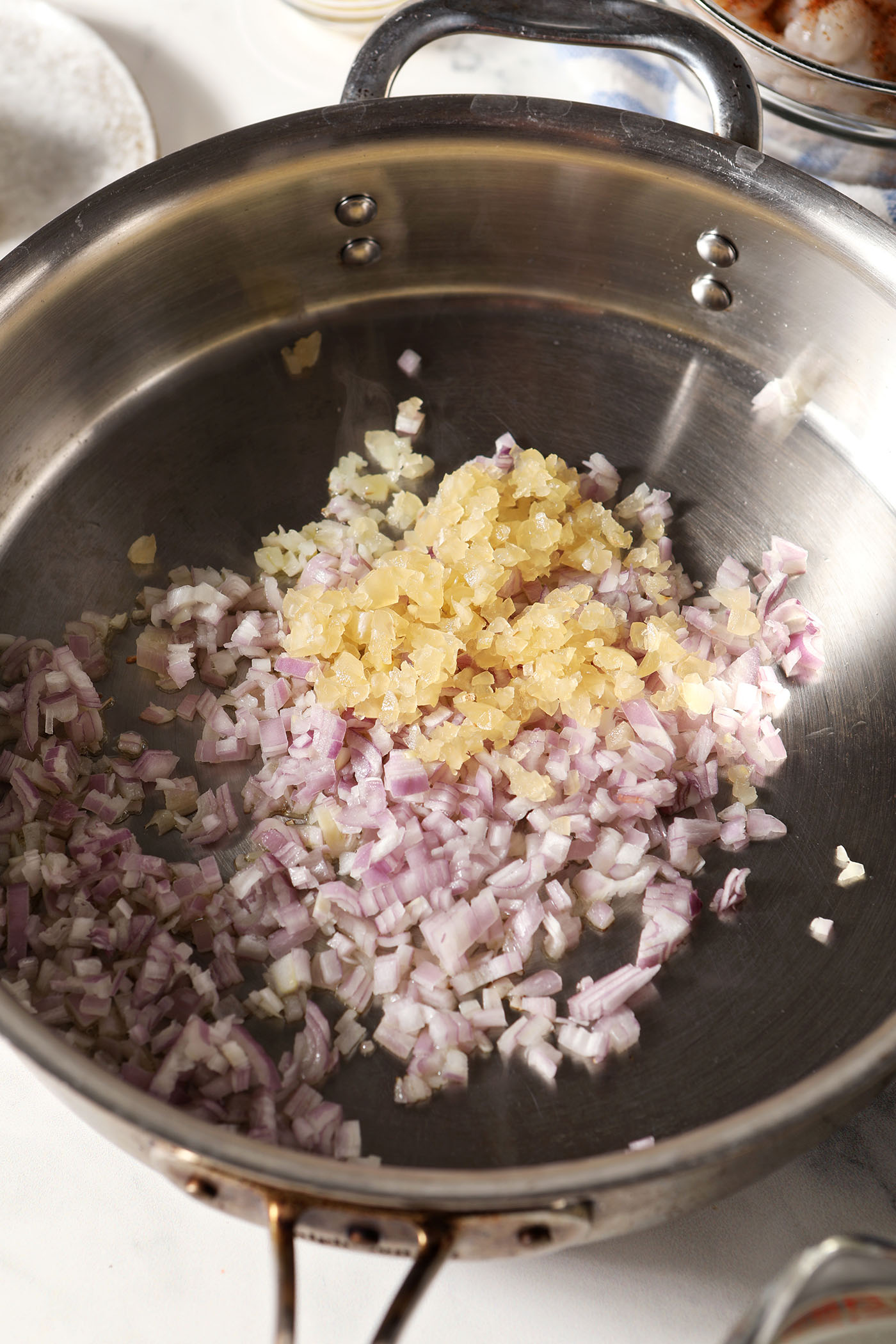 Shallot and garlic in a pan with oil before cooking