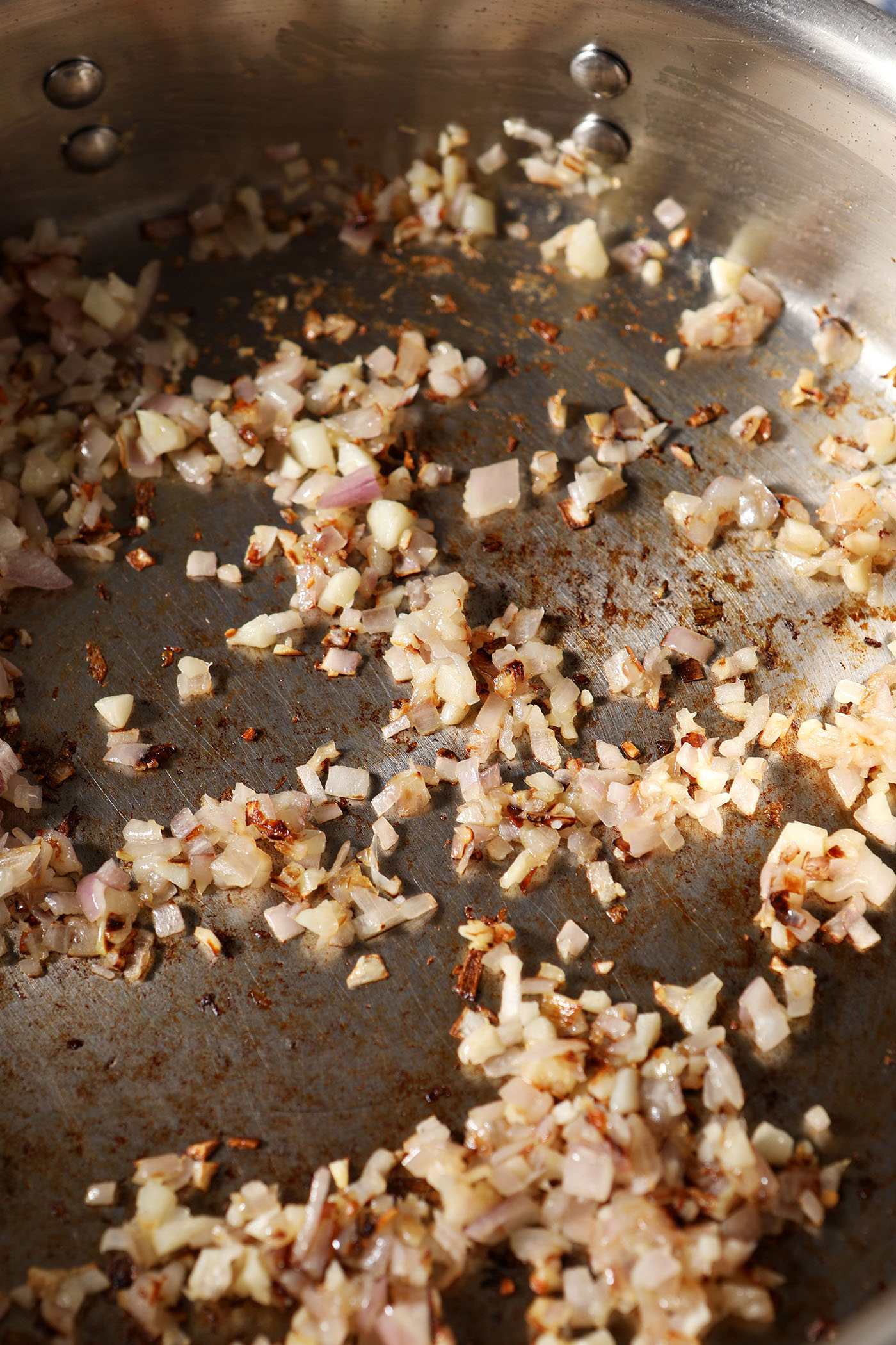 Shallot and garlic in a pan with oil after cooking