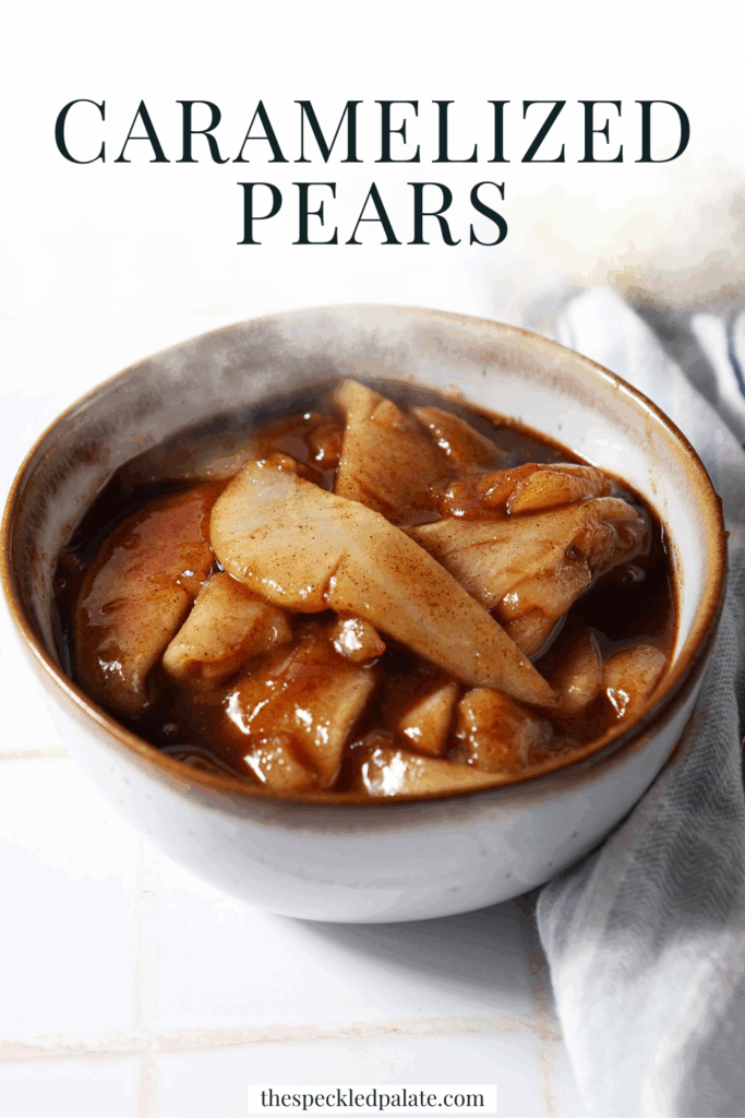 A bowl of caramelized pears on a white tiled surface next to a blue striped linen and a green pear with the text caramelized pears