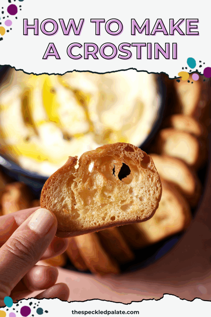 A hand holds a crostini above creamy dip and a platter with more crostini with the text how to make a crostini