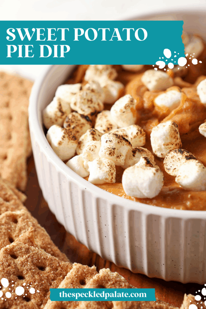 Close up of Sweet Potato Pie Dip topped with toasted marshmallows in a white bowl next to graham crackers with the text sweet potato pie dip