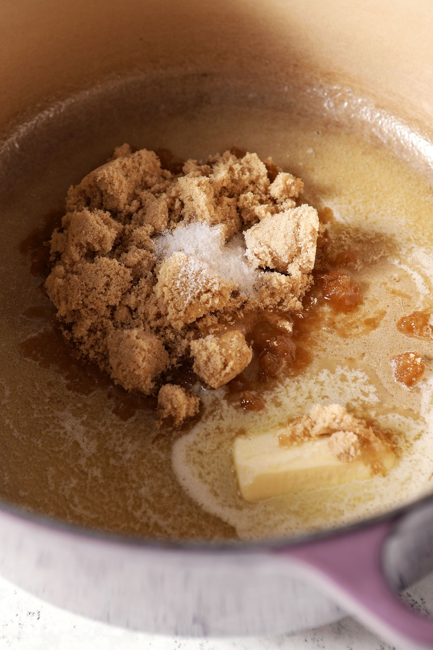 Brown sugar, salt and butter melt together in a large purple pot