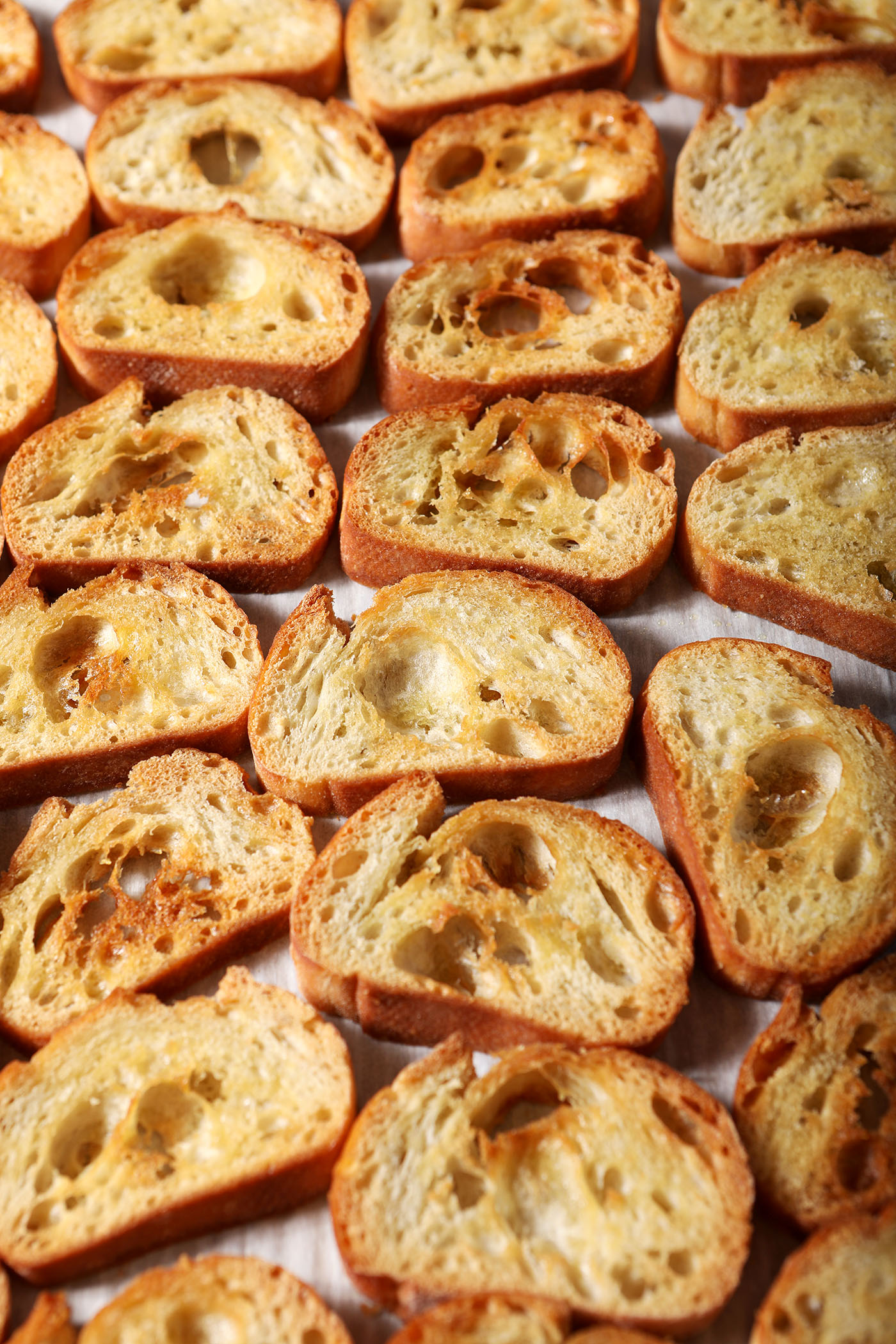 Crostini on a sheet pan, after baking
