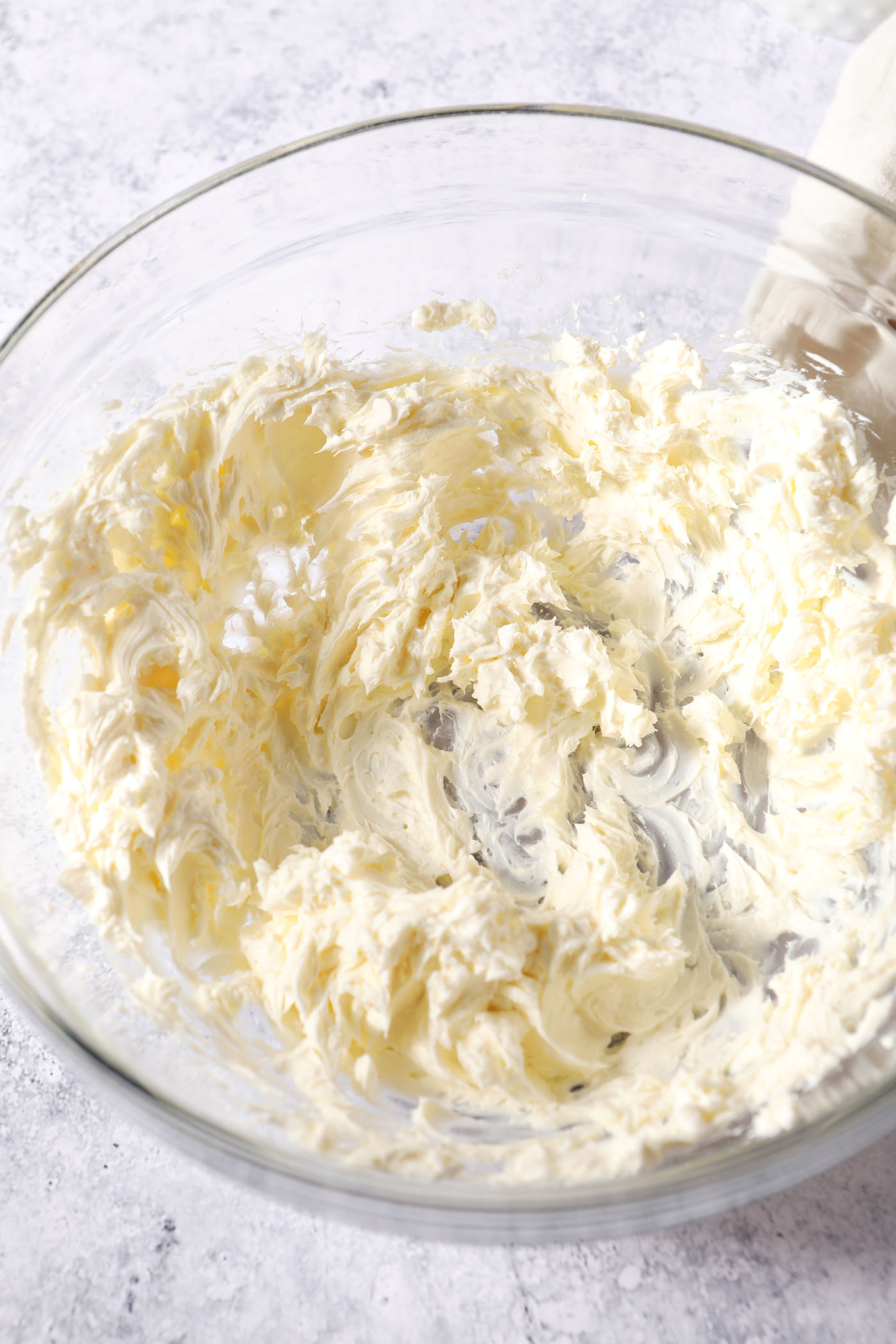 Whipped cream cheese in a large glass bowl