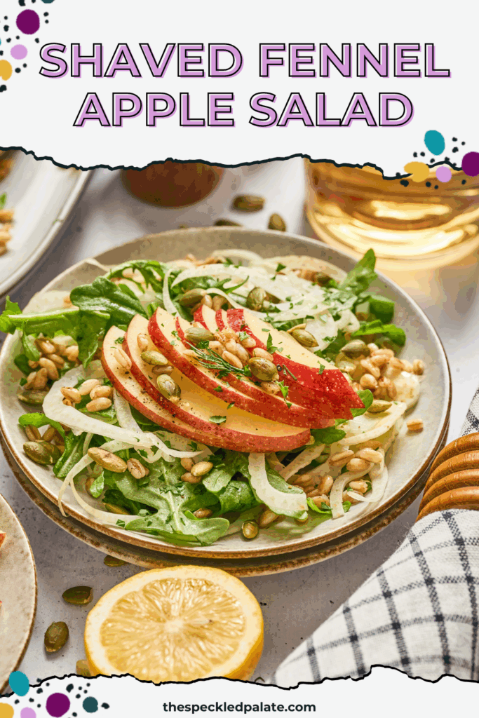 Overhead of a place of apple fennel salad with farro surrounded by pepitas and apples with the text shave fennel apple salad