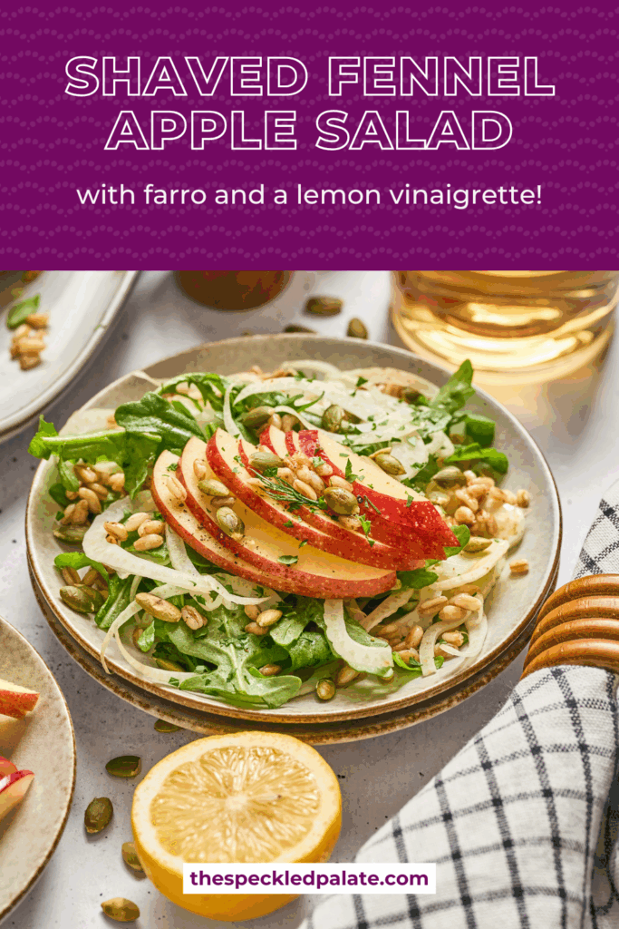 Overhead of a place of apple fennel salad with farro surrounded by pepitas and apples with the text shave fennel apple salad with farro and a lemon vinaigrette