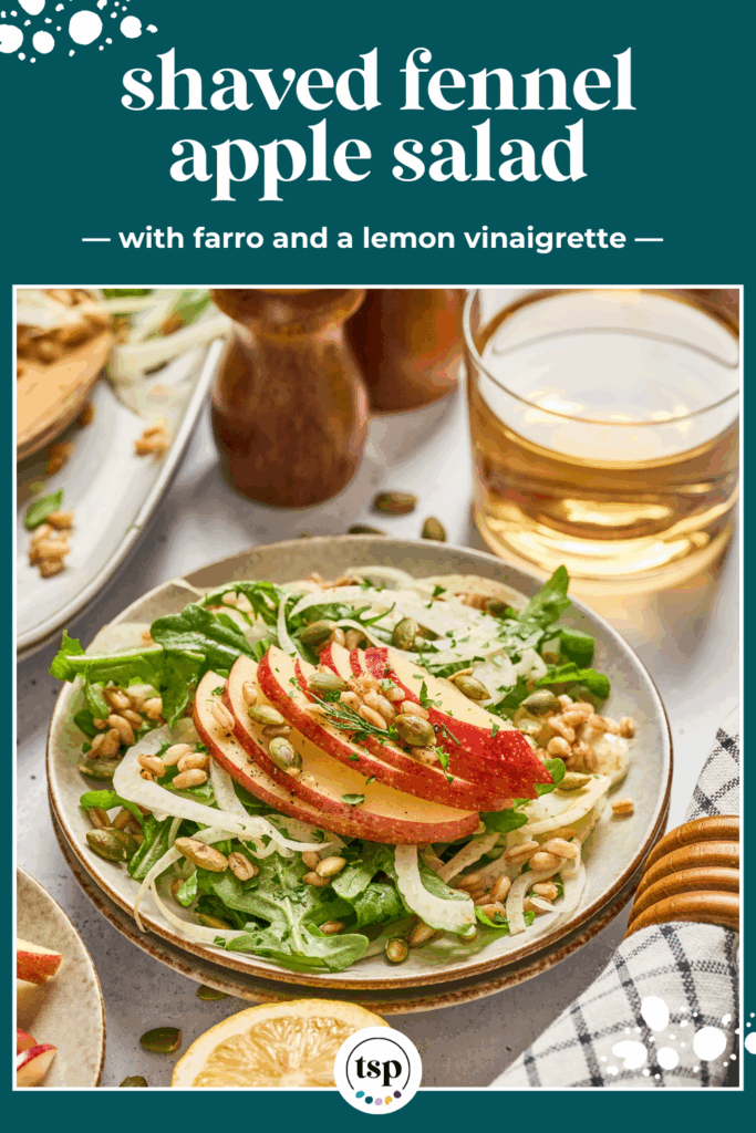 Overhead of a place of apple fennel salad with farro surrounded by pepitas and apples with the text shave fennel apple salad with farro and a lemon vinaigrette