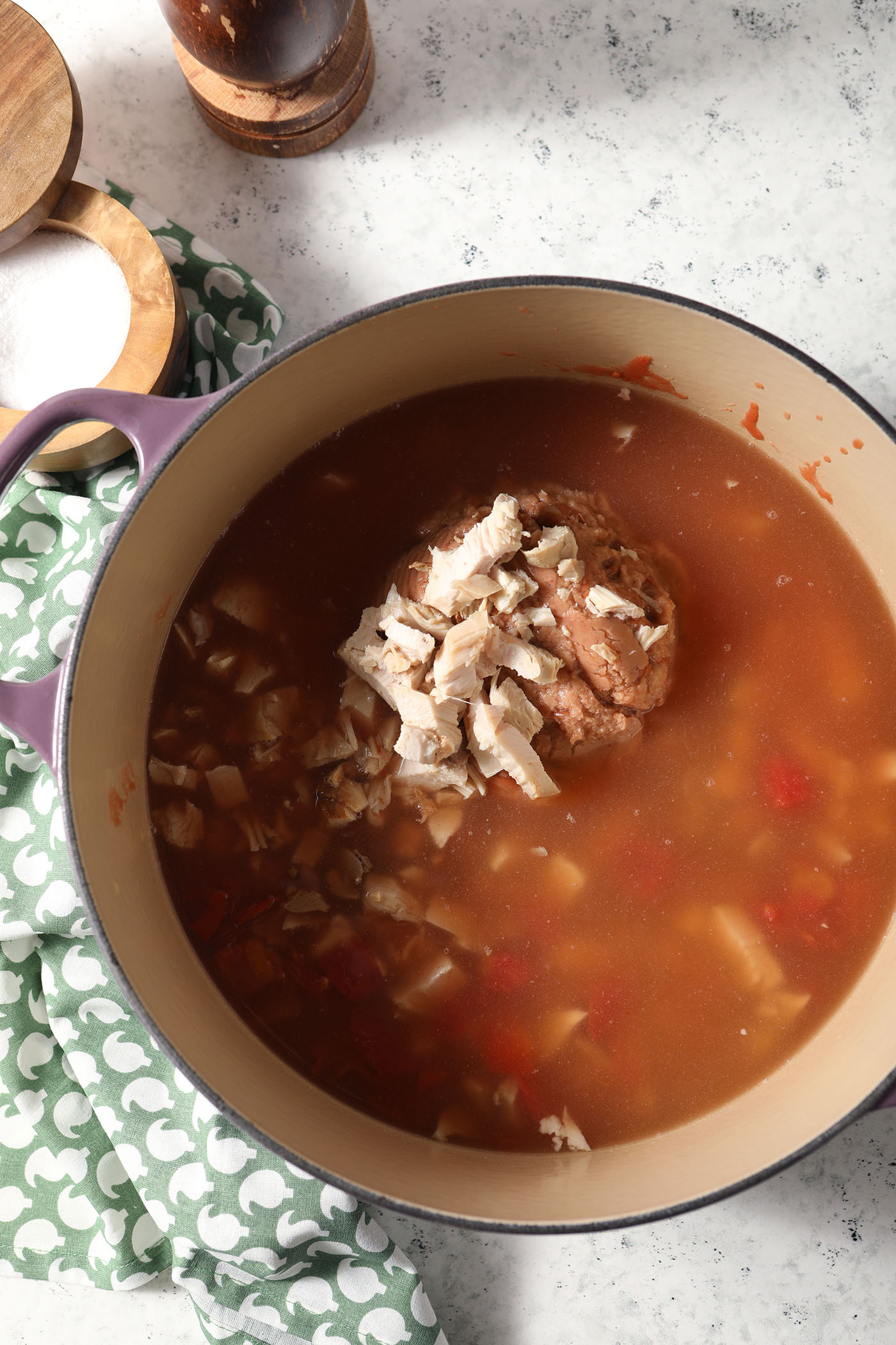 Ingredients for turkey tortilla soup in a dutch oven