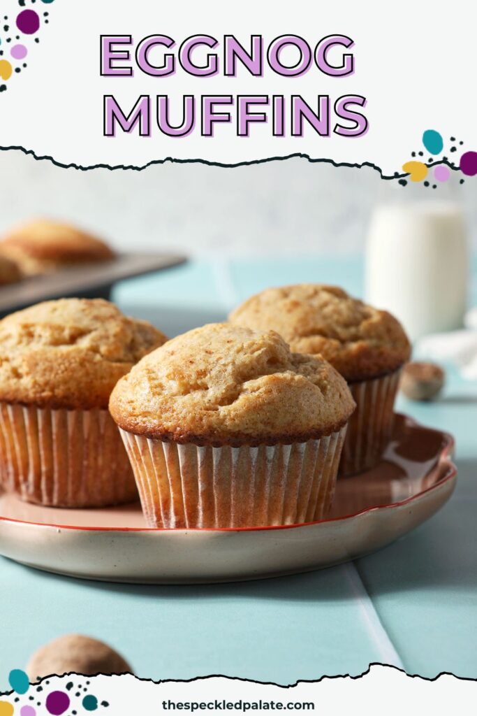 A plate of muffins on a green tiled surface in front of a muffin tin with the text eggnog muffins