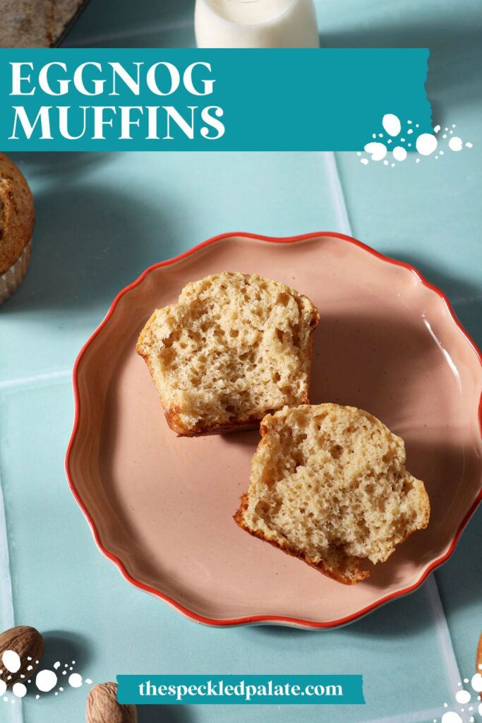 A pink plate with a halved muffin on a green tiled surface with the text eggnog muffins