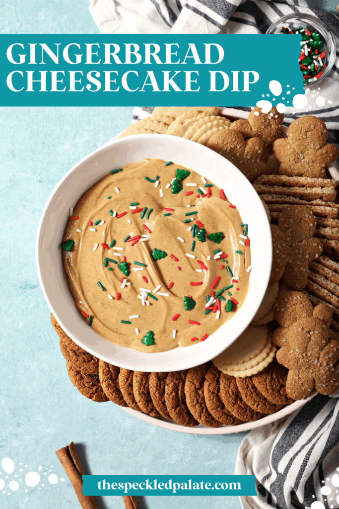 A bowl of gingerbread dip next to cookies and crackers on a teal surface with the text gingerbread cheesecake dip
