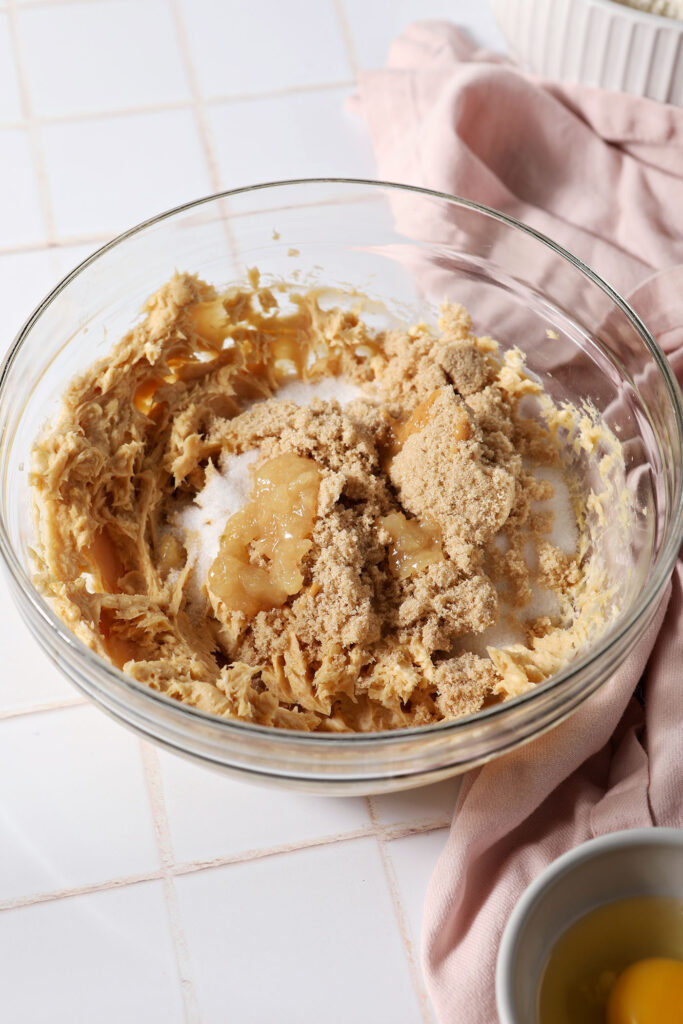 Brown sugar, white sugar and ginger on top of a butter mixture before blending