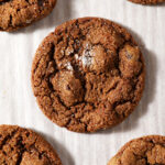 Chocolate Gingerbread Cookies on white parchment paper after baking