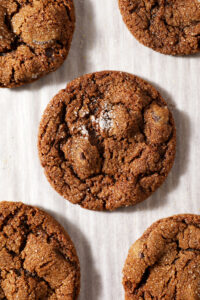 Chocolate Gingerbread Cookies on white parchment paper after baking