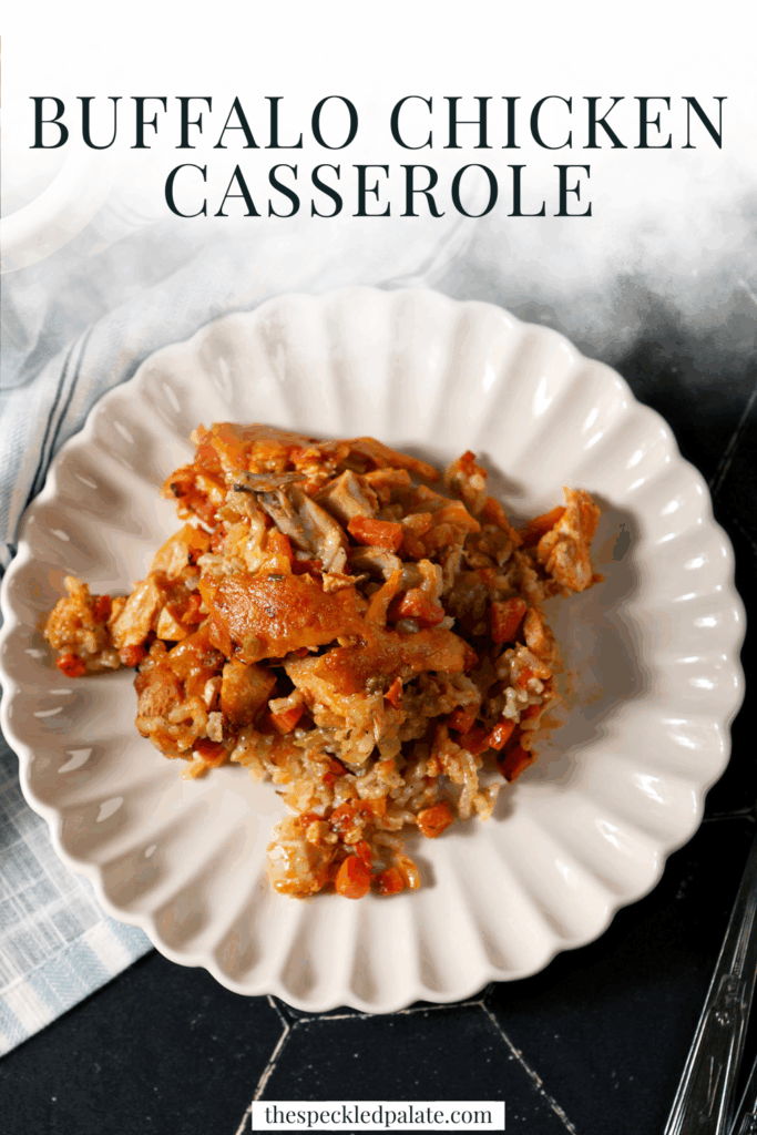 A serving of Buffalo Wing Casserole on a plate next to a casserole dish with the text buffalo chicken casserole