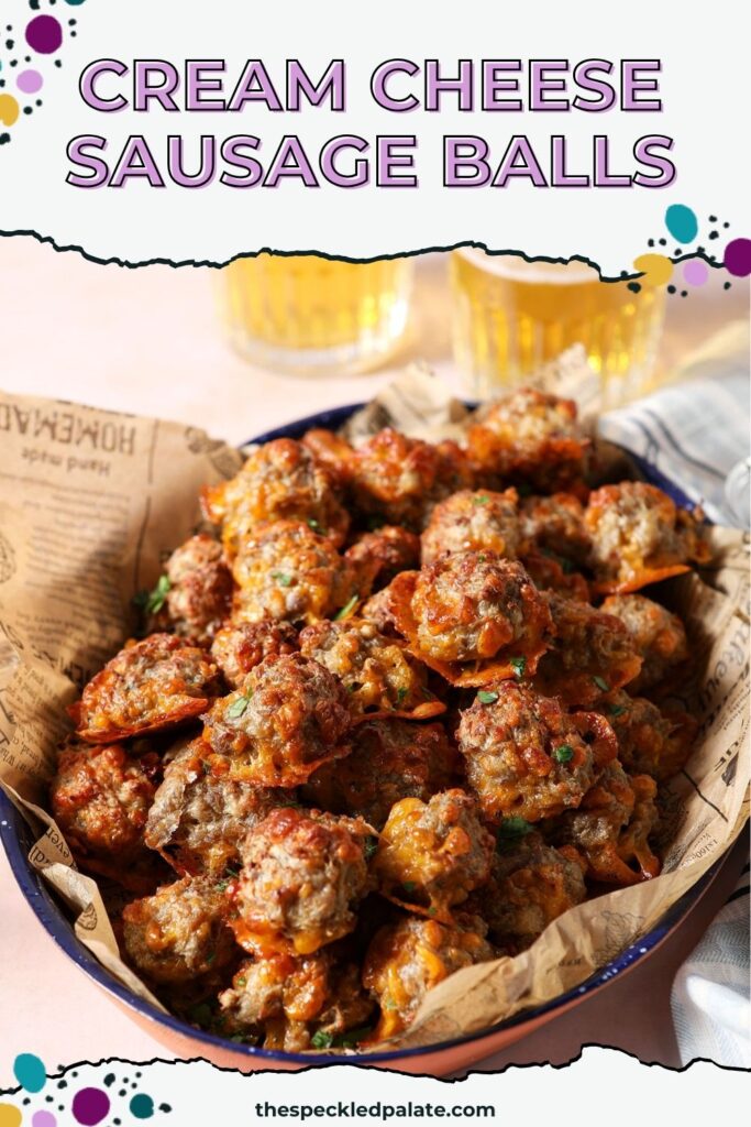 A platter of cream cheese sausage balls without bisquick on a stone surface in front of two glasses of beer with the text cream cheese sausage balls