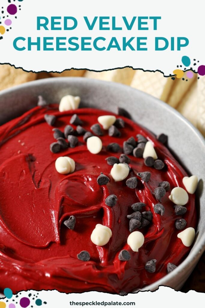 Close up of a bowl holding red velvet dip, garnished with white and regular chocolate chips with the text red velvet cheesecake dip